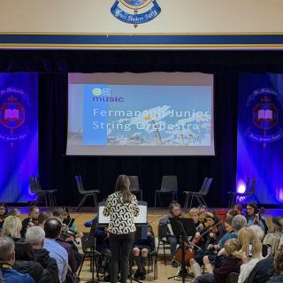 Pupils performing in an orchestra