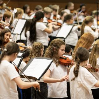 Young musicians performing in a concert