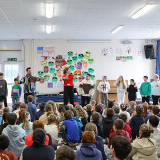 Young musicians performing vocal activities in a Benedetti rehearsal