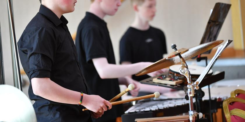 Percussion section in youth orchestra concert