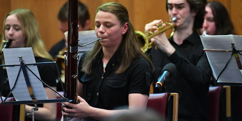 bassoonist performing in orchestra concert