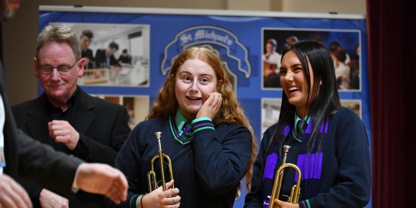 Youth band trumpet section enjoy themselves after a performance